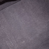 Dark navy quilted leather fabric close-up with fine crosshatch texture