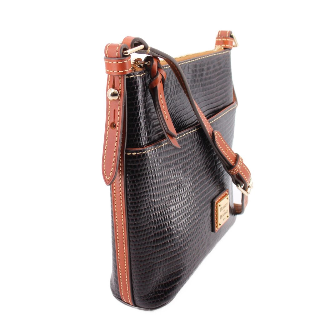 Black textured crossbody bag with tan strap, front flap details, metal hardware
