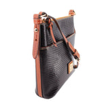 Black textured crossbody bag with tan strap, front flap details, metal hardware