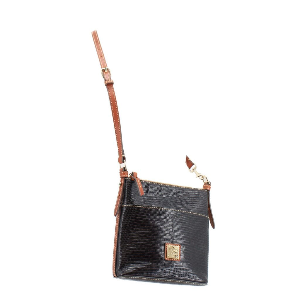Black textured small crossbody bag with tan adjustable strap and front logo patch