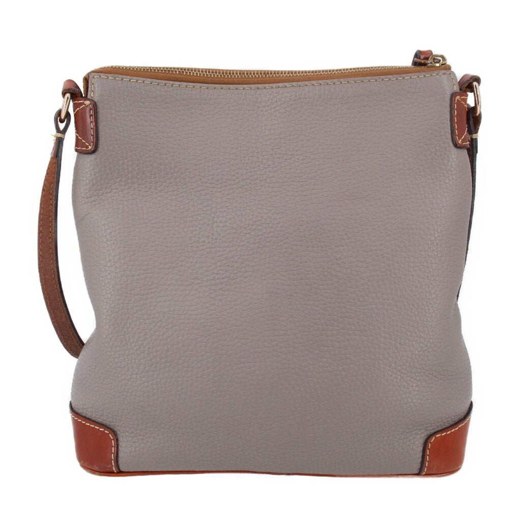 Taupe pebbled leather crossbody with top zip, brown corner feet, and strap tabs
