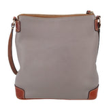 Taupe pebbled leather crossbody with top zip, brown corner feet, and strap tabs