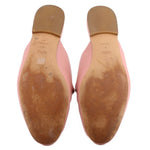 COACH pink mule loafers, outsole view with tan leather bottom and heel tread