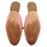 COACH pink mule loafers, outsole view with tan leather bottom and heel tread