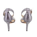 Silver glitter stiletto heeled sandals, rear view with thin high heel