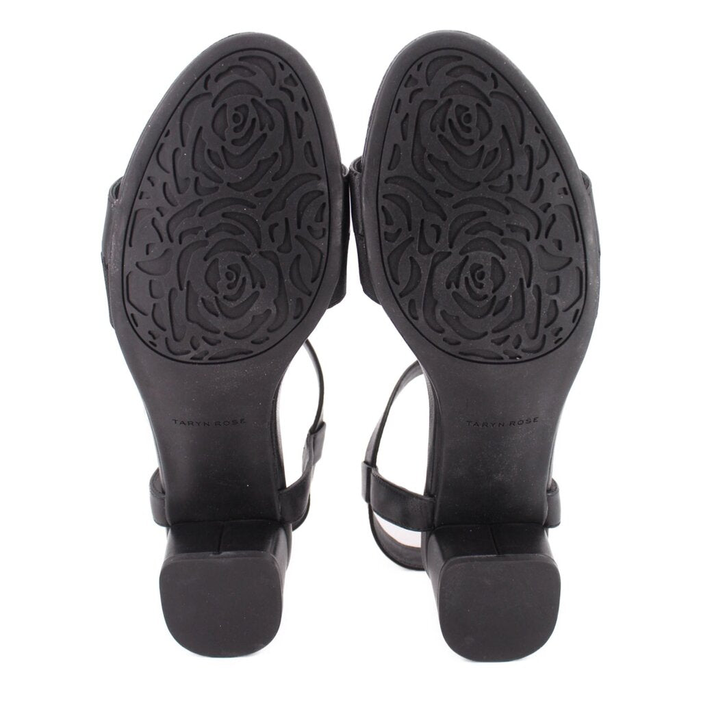 Black sandals outsole view with embossed tread and Taryn Rose branding