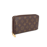 Louis Vuitton Zippy wallet in brown Monogram canvas, side view with zip closure