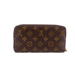 Zippy wallet in brown Monogram canvas with gold-tone zipper and top seam