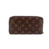 Zippy wallet in brown Monogram canvas with gold-tone zipper and top seam