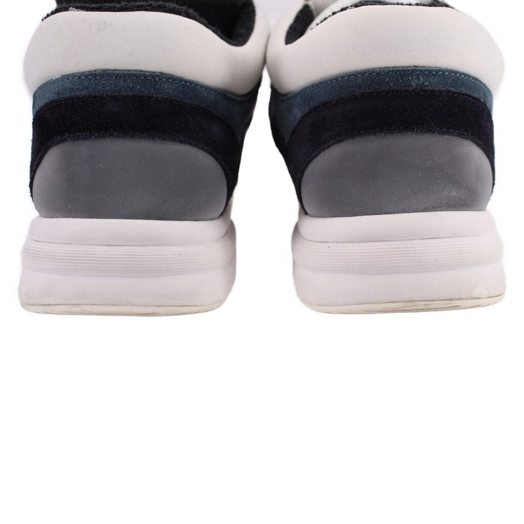 CHANEL suede trainer sneakers, back view with cushioned heel and white rubber sole