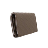 Olive leather Blondie wallet angled side view with quilted stitching and slim profile