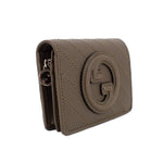 Olive leather Blondie wallet side view with metal zipper pull and Gucci G crest