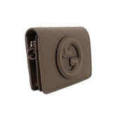 Olive leather Blondie wallet side view with metal zipper pull and Gucci G crest