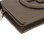 Olive leather Blondie wallet corner close-up with layered seams and zipper hardware