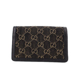 Dionysus mini crossbody flap, black denim GG monogram front