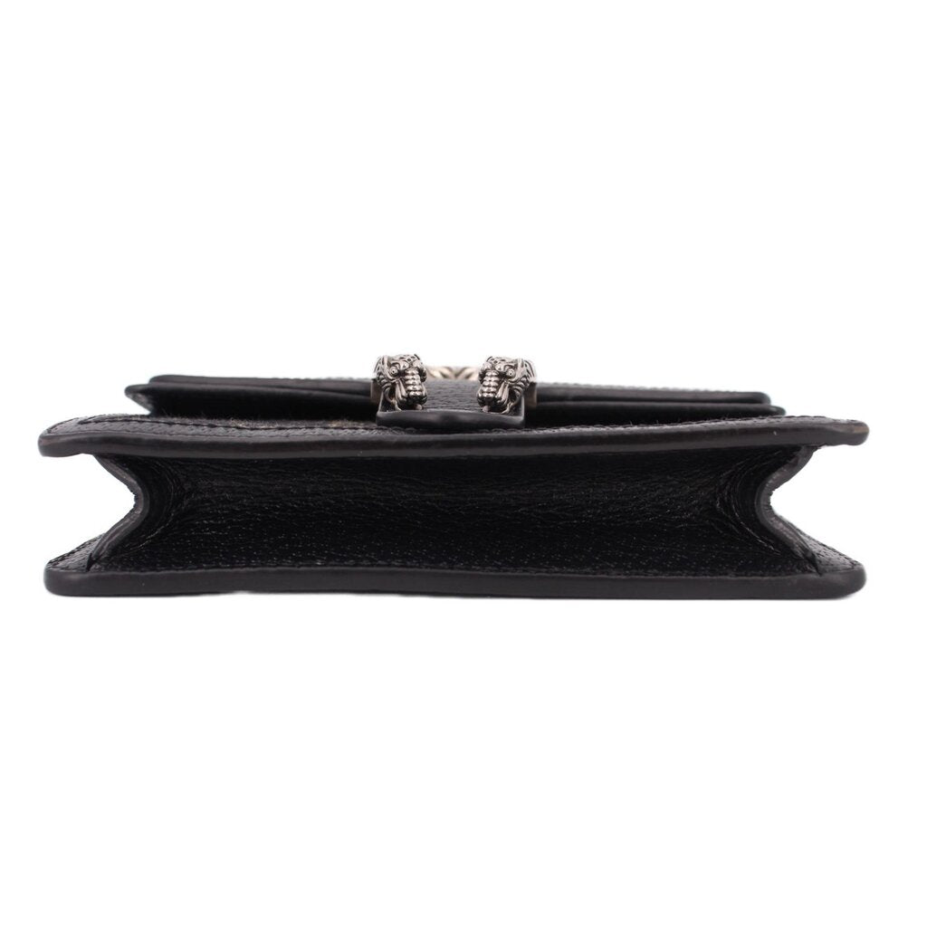 Dionysus mini crossbody, top view with chain strap and black leather base