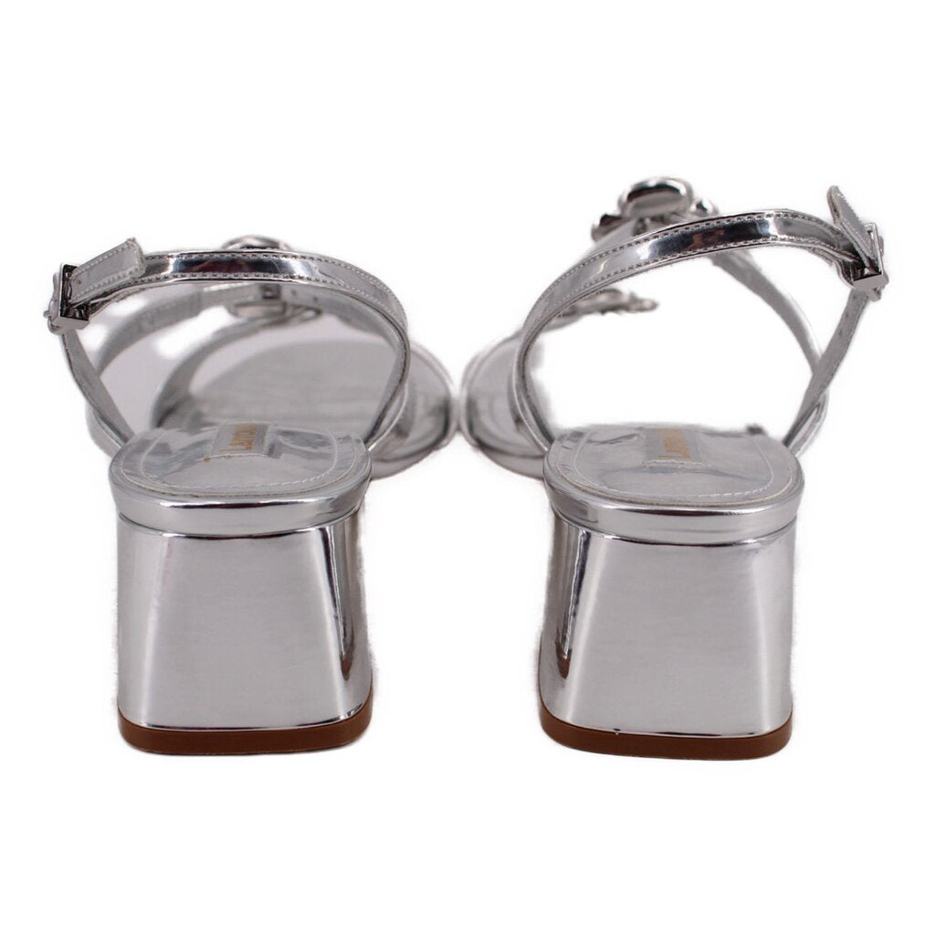 Metallic silver heeled sandals with ankle strap and squared heel