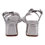 Metallic silver heeled sandals with ankle strap and squared heel