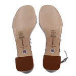 Metallic silver sandal insoles with printed care and size labels