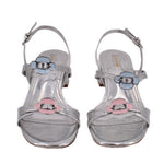 Metallic silver heeled sandals with two front buckles and ankle strap