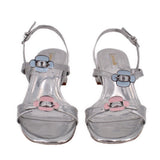 Metallic silver heeled sandals with two front buckles and ankle strap