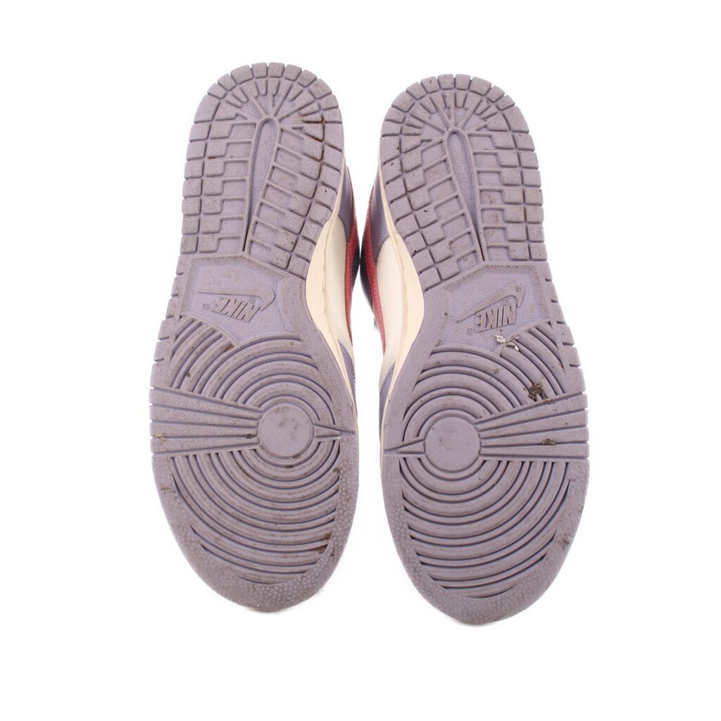 Nike leather sneakers outsole view, purple tread with patterned grooves
