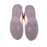 Nike leather sneakers outsole view, purple tread with patterned grooves