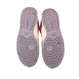 Nike leather sneakers outsole view, purple tread with patterned grooves