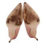 Coach Waverly pink pump heels, underside view; beaded trim with scuffs