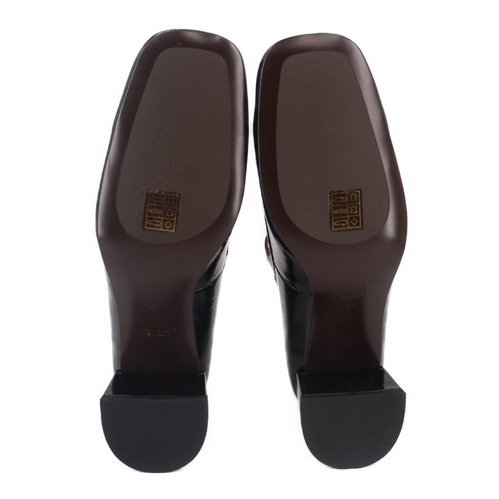 Black patent Mary Jane heels with stamped sole and block heel bottom view