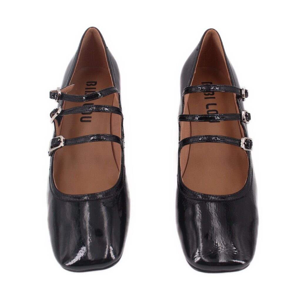 Black patent Mary Jane heels with two strap buckles across the foot and round toe