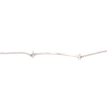 Close-up of white gold bracelet bar centerpiece on fine chain