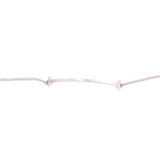 Close-up of white gold bracelet bar centerpiece on fine chain