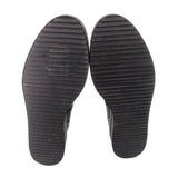 Black platform flats outsole with deep horizontal tread pattern