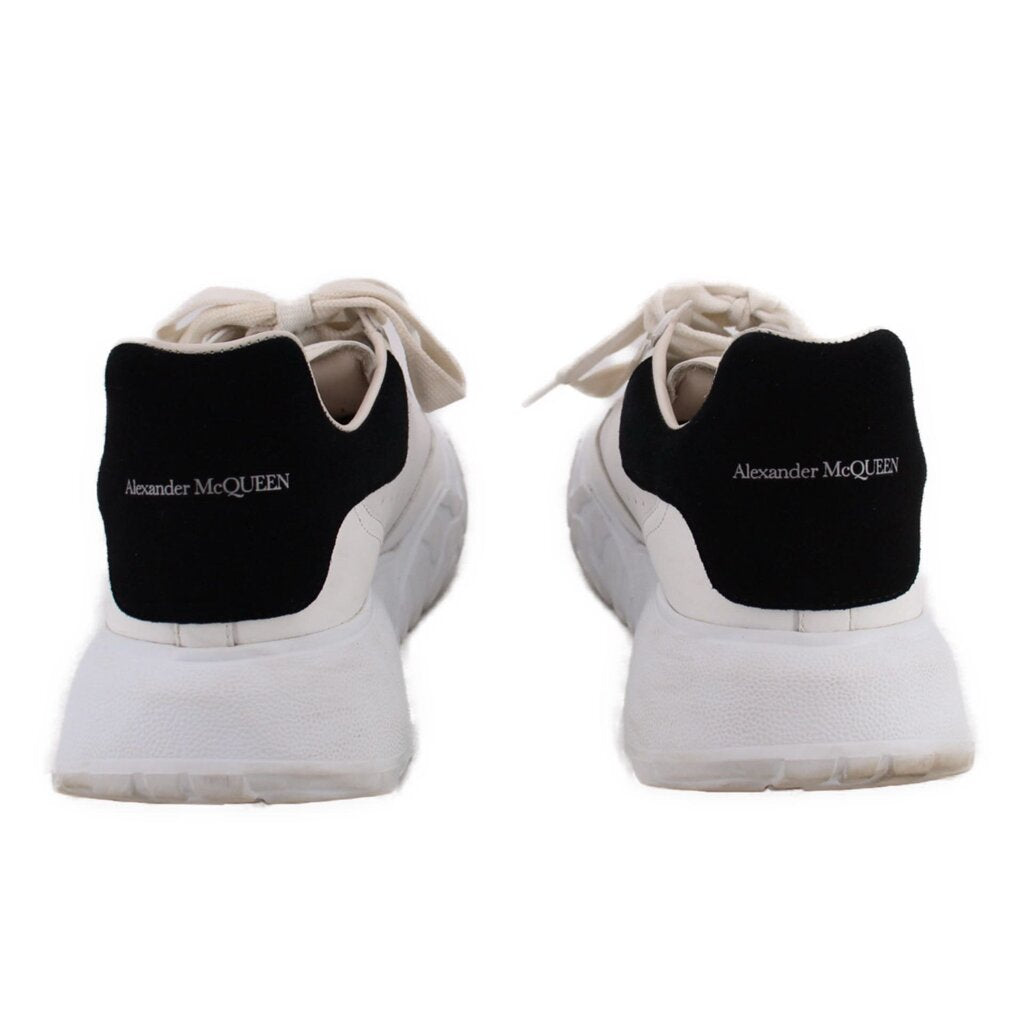 White women's court trainer sneakers with black Alexander McQueen heel pull tab
