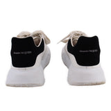White women's court trainer sneakers with black Alexander McQueen heel pull tab