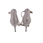 Back view of black-and-white striped heeled sandals with stiletto heel