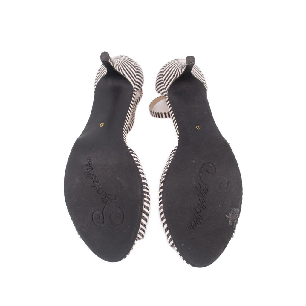 Black striped sandal heel soles with printed logo marks and open-toe shape