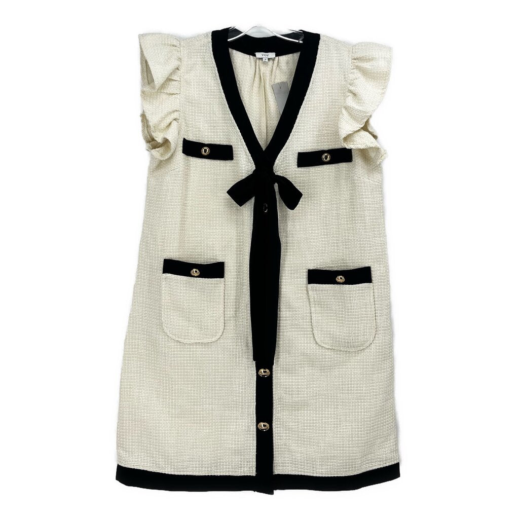 White and black button-up dress with ruffled sleeves, patch pockets, and black bow tie