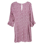 Reformation floral dress in pink with gathered neckline and loose ruffled sleeves