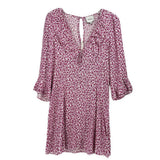 Reformation floral dress in pink with three-quarter sleeves and keyhole back
