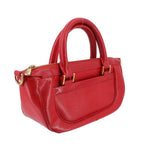 Red LOUIS VUITTON Dhanura PM crossbody bag side view with top handles and gold zippers