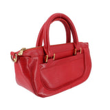 Red LOUIS VUITTON Dhanura PM crossbody bag side view with top handles and gold zippers