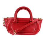 Red LOUIS VUITTON Dhanura PM crossbody bag with gold-tone hardware and adjustable strap