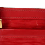 Close-up of red stitching and textured leather panel on DHANURA PM