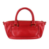 Red DHANURA PM handbag with dual top handles, zip top edge, and front detailing
