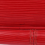 Close-up of red textured leather surface with seam details