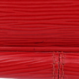 Close-up of red textured leather surface with seam details