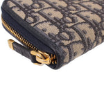 CHRISTIAN DIOR long zip wallet corner close-up, Dior Oblique monogram with gold hardware