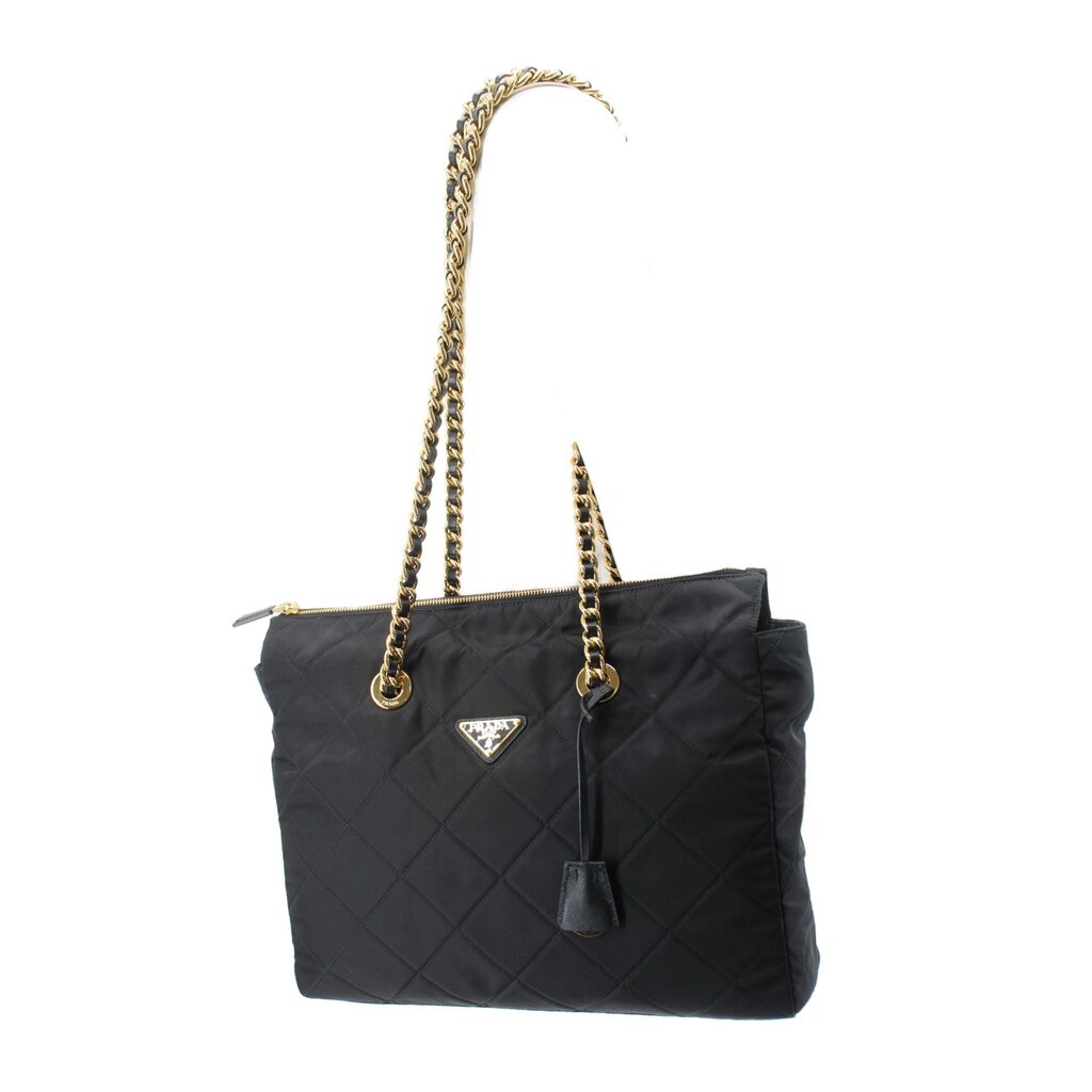 Black quilted tote bag with gold chain top handles, front Prada triangle logo, zip